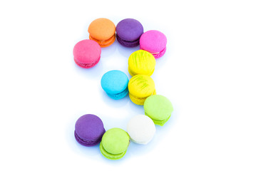 Colorful macarons,number 3 on white background