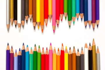 Row of color pencil on white background
