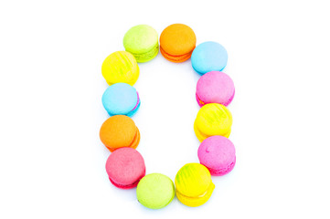 Colorful macarons,number 0 on white background