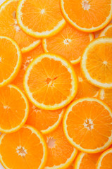 citrus background. juicy slices of orange cover the entire surface