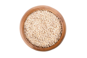 pearl barley in a wooden bowl. for healthy cooking ingredient
