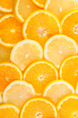 citrus background. juicy slices of lemon and orange cover the entire surface.
