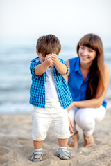 Family resting on the sea and have fun on a bright sunny day