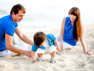 Family resting on the sea and have fun on a bright sunny day