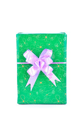 green gift box with violet ribbon bow isolated on white backgrou