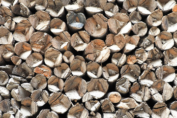 Uneven natural side of wooden logs abstract background texture