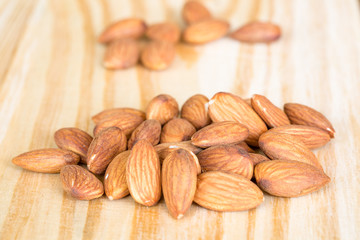 roasted almonds on wooden table