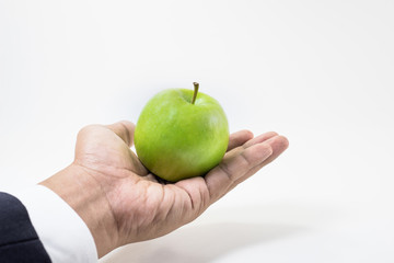 Business market share concept.Green apple on hand.