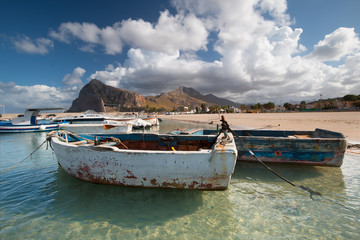 Fototapeta na wymiar Old Boats in a port in San Vito Lo Capo, Sicily, Italy