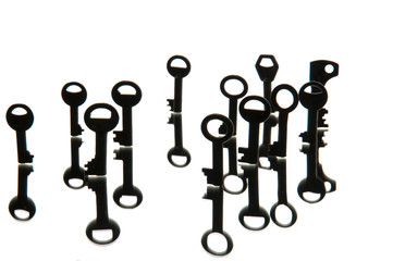 Old rusty keys on white wooden table