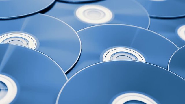 parallax tracking shot over a pile of digital versatile discs