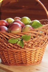 Apples in a wicker basket, autumn harvest.