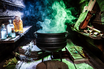 Witcher cauldron with blue potions and books for Halloween