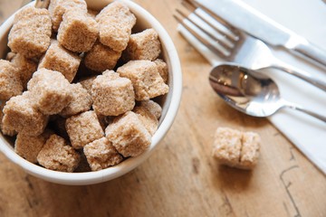 Bowl with brown sugar and silverwear