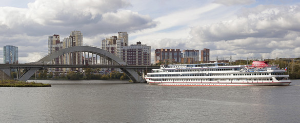 Panorama of the City of Moscow, with the river steamer and a bridge in the autumn.