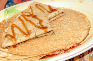 Thin russian pancakes on the plate. Maslenitsa is coming