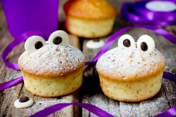 Halloween funny monster muffins with chocolate eyes