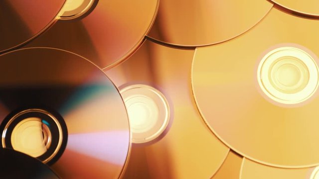 dolly tracking shot over a pile of digital versatile discs