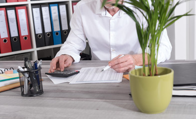 Fototapeta premium Businessman doing his accounting