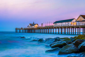 Southwold Pier, a popular English seaside destination in Suffolk, at sunset