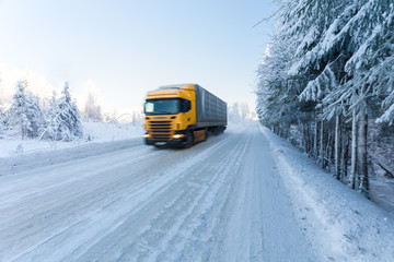 Motion blur of a  truck on winter road on frosty day © Zakhar Marunov