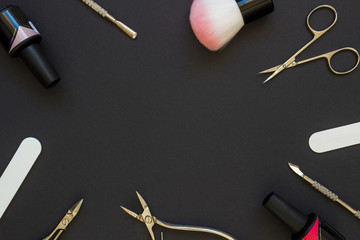 Manicure tools on the dark background