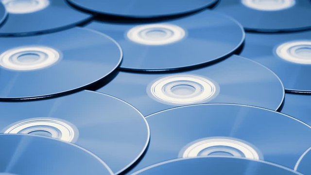 dolly tracking shot over a pile of digital versatile discs