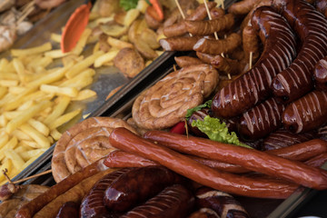 Sausages and french fries on a street food market in Europe