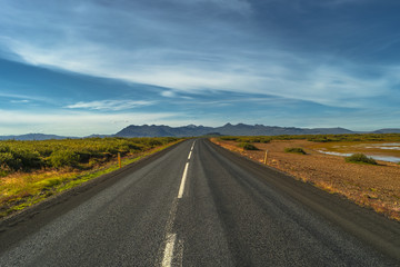 Isolated road and Icelandic colorful landscape at Iceland, summe