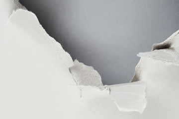 Torn grey paper