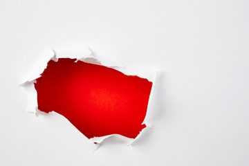 Red hole in the paper