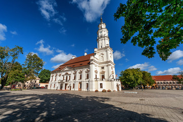 Beautiful view of Kaunas Town Hall on square with cloudy sky on background