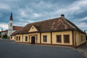 Fototapeta na wymiar Central square with Romanian Greek Catholic Church in Miercurea Sibiului town in Romania