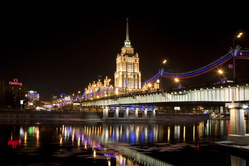 Fototapeta na wymiar View of the hotel Ukraine, Novoarbatsky bridge, Moscow river at night, Moscow, Russia