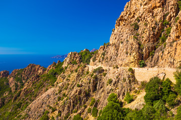 Fototapeta na wymiar Calanques de Piana with the D81 coastline road on the west coast of Corsica, France