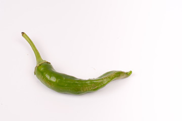 Green chilli pepper over white background