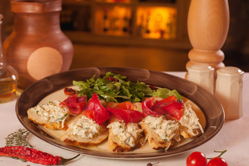 Toast with red fish and greens on a plate