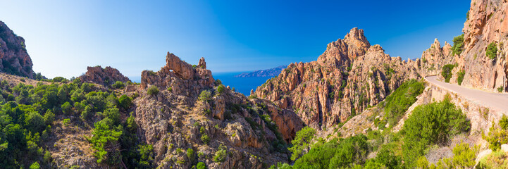Calanques de Piana with the D81 coastline road on the west coast of Corsica, France - obrazy, fototapety, plakaty