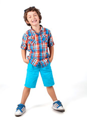 Happy and cute funny fashionable little boy in blue shirts 