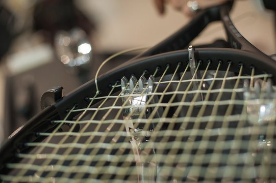 Racket stringing. Detail of tennis racket in the stringing machine