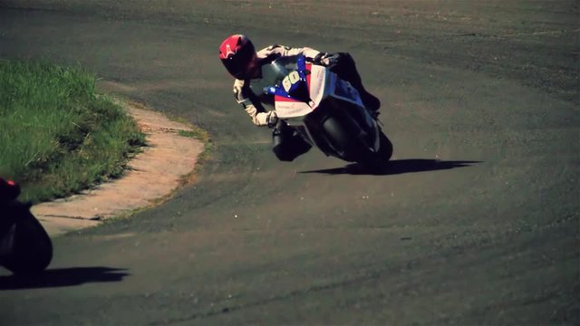 Motorcycle racing HD slow motion static video. Moto riders in turn on circuit road track. Extreme sport concept