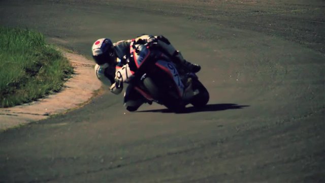 Motorcycle racing HD slow motion static video. Moto riders on bike in turn on circuit road race track. Extreme sport concept