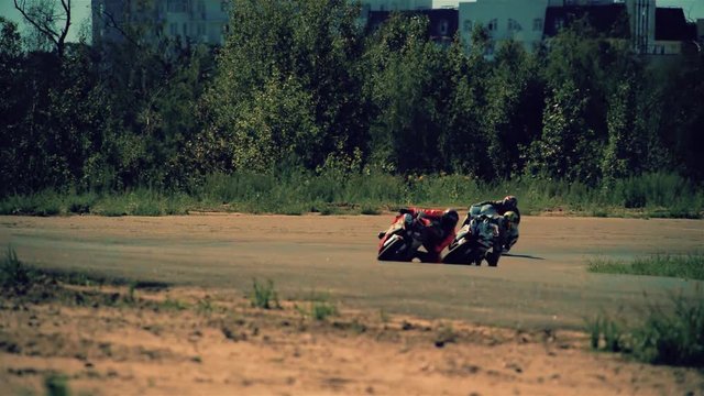 Motorcycle racing HD slow motion static video. Moto riders in turn on circuit road track. Extreme sport concept