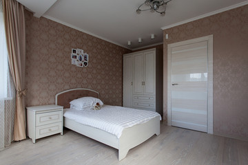 Fototapeta na wymiar Interior of a bedroom in light brown tones for little girl