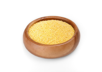 millet groats in a wooden bowl on a white background. ingredient for a healthy lifestyle. 