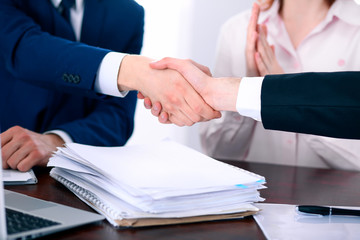 Business people shaking hands finishing up a meeting