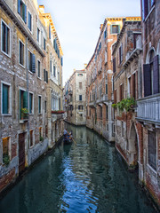 Venice canal with gondolieri