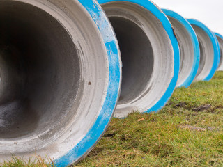 Row of concrete drainage pipes