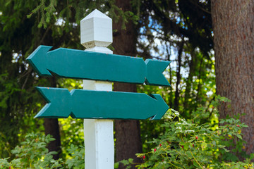 view of two wooden directional signs
