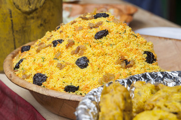 Cooked couscous with dried plums and raisin